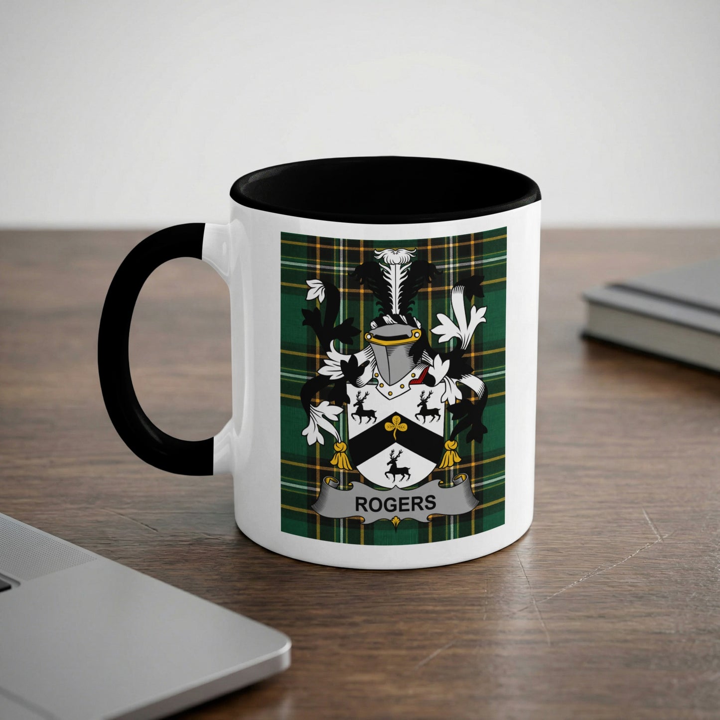 White mug with black handle featuring the Rogers family crest on a green tartan background.