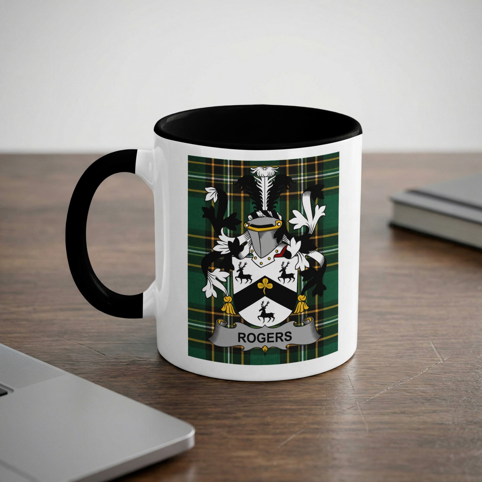 White mug with black handle featuring the Rogers family crest on a green tartan background.
