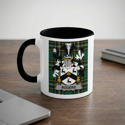 White mug with black handle featuring the Rogers family crest on a green tartan background.