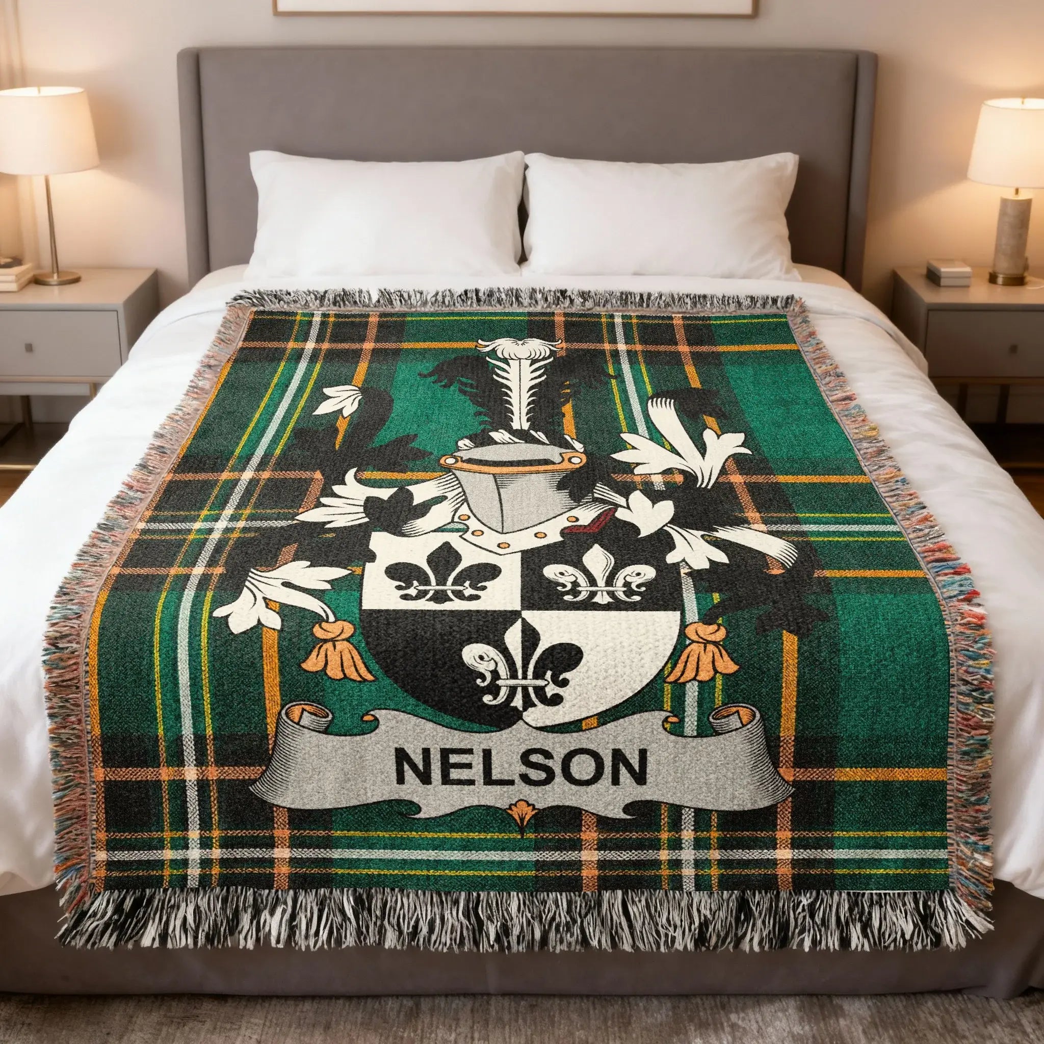 Green plaid blanket with a coat of arms featuring the name NELSON.