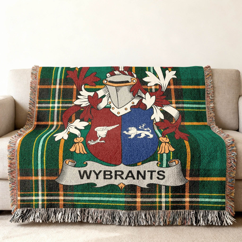 Woven blanket with green tartan pattern and a coat of arms displaying "WYBRANTS".