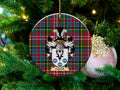 Caddell Scottish clan ceramic ornament with family crest on a Caledonia tartan background, hanging on a Christmas tree
