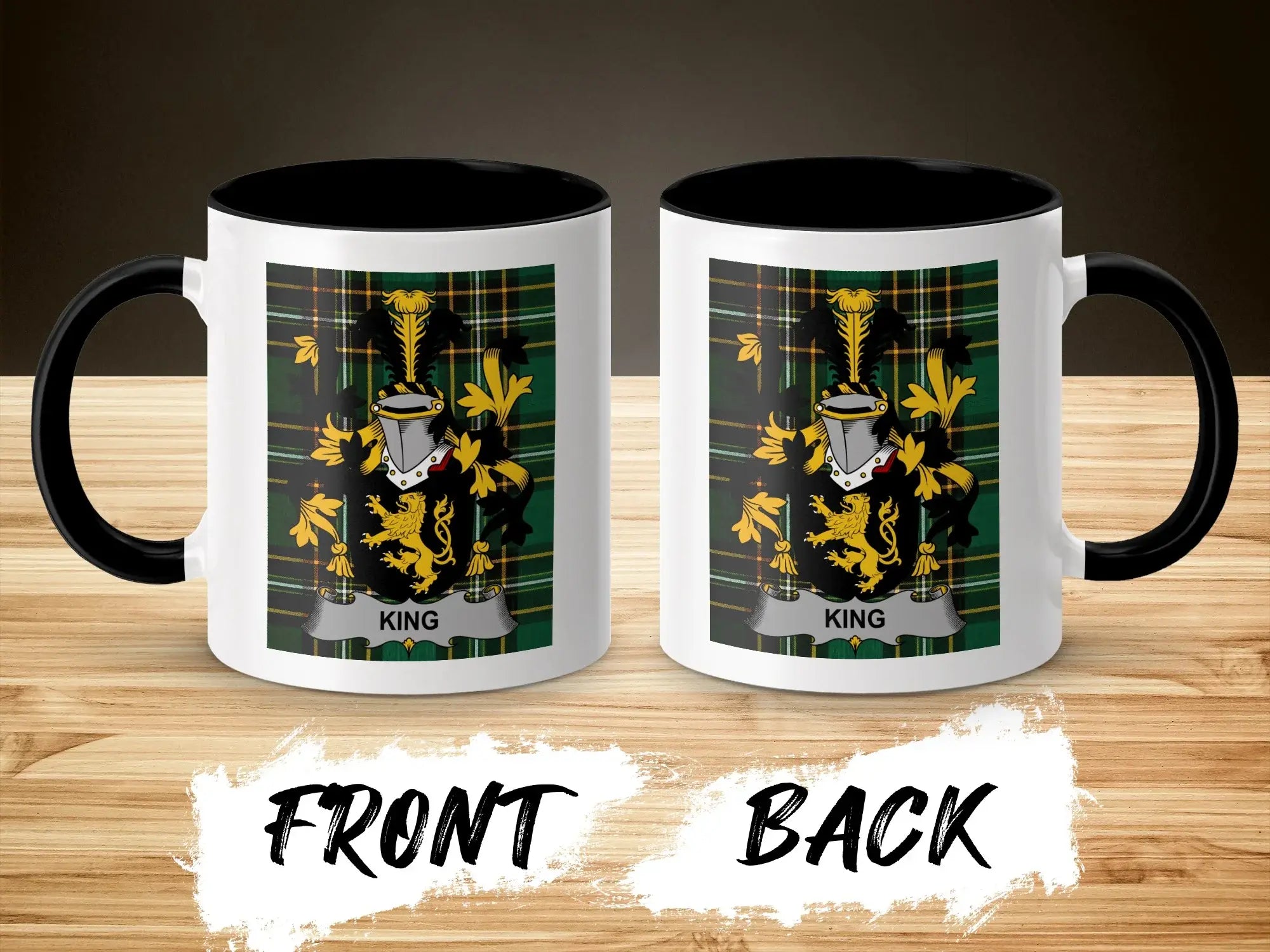 Mug with King crest on front and back, set against a wooden background.
