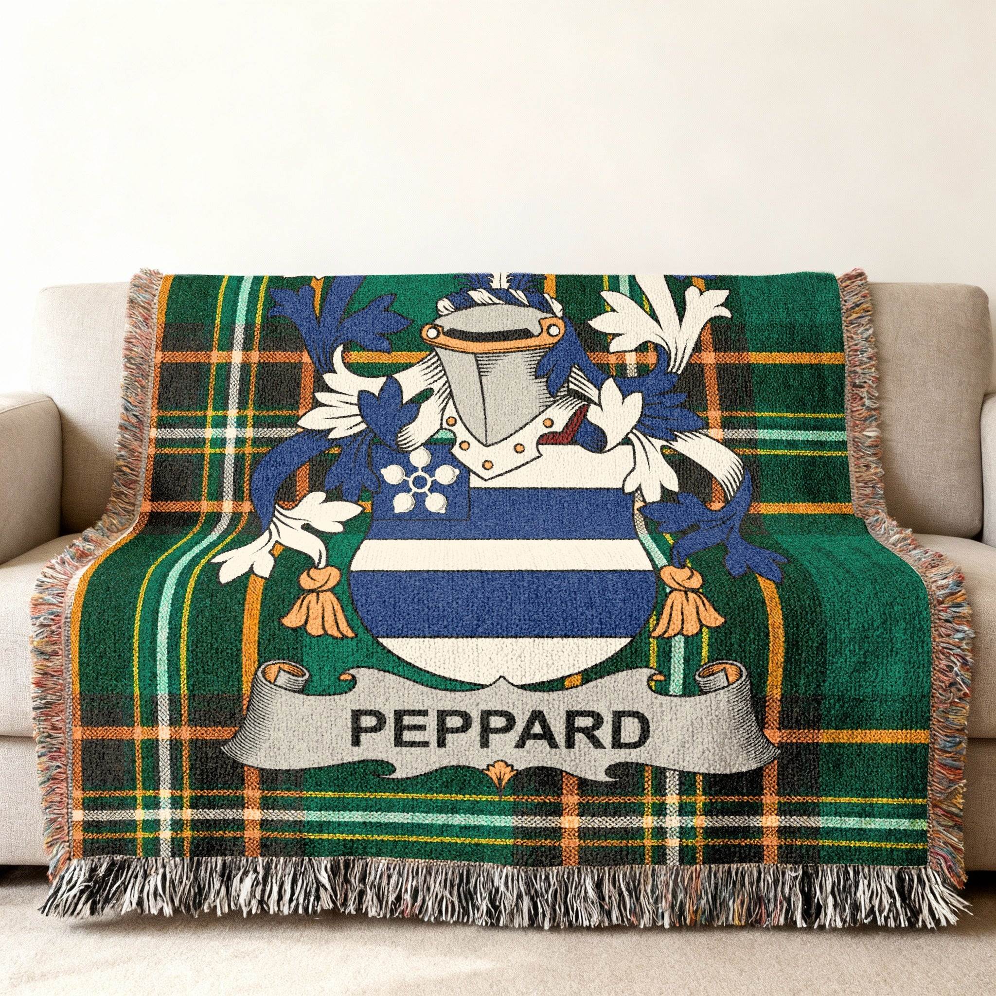 Woven throw blanket with Peppard family crest on green plaid.