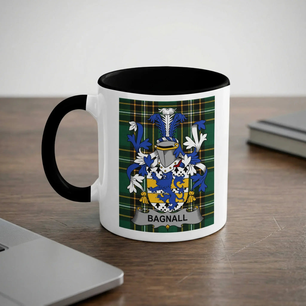 White mug with black rim and handle displaying a coat of arms with the name BAGNALL.