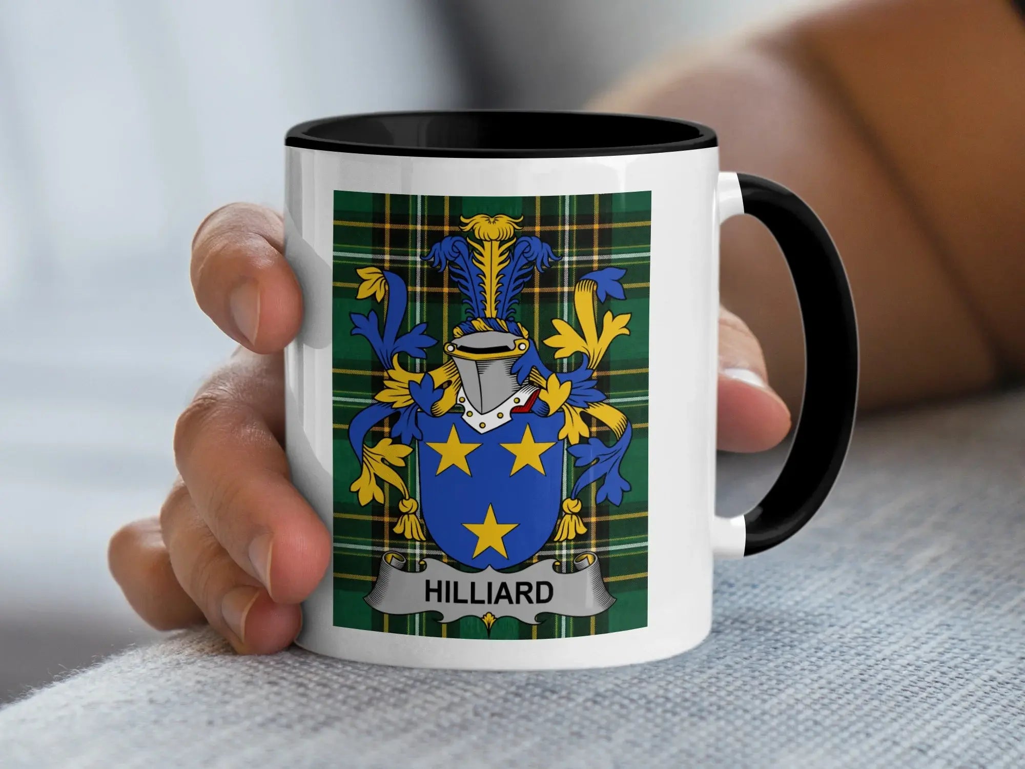 Mug with the Hilliard family crest on a plaid background.