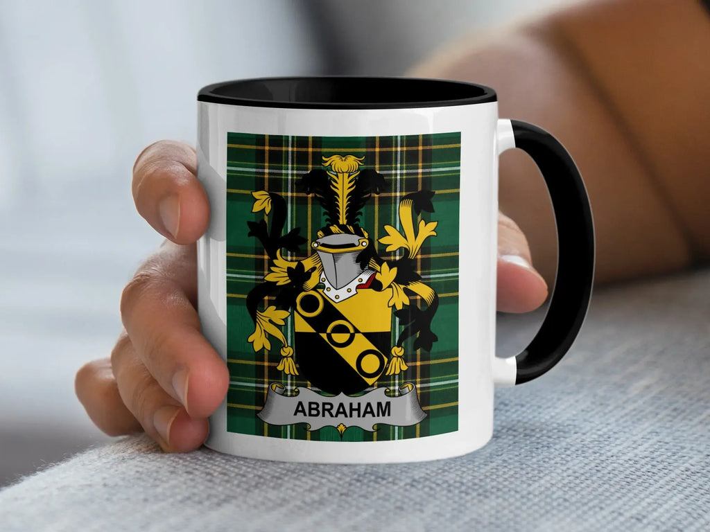 Mug with Abraham family crest on green plaid background.