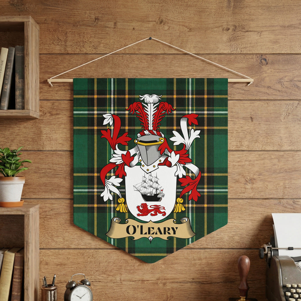 O'LEARY family crest on a green plaid pennant, displayed on a wooden wall.