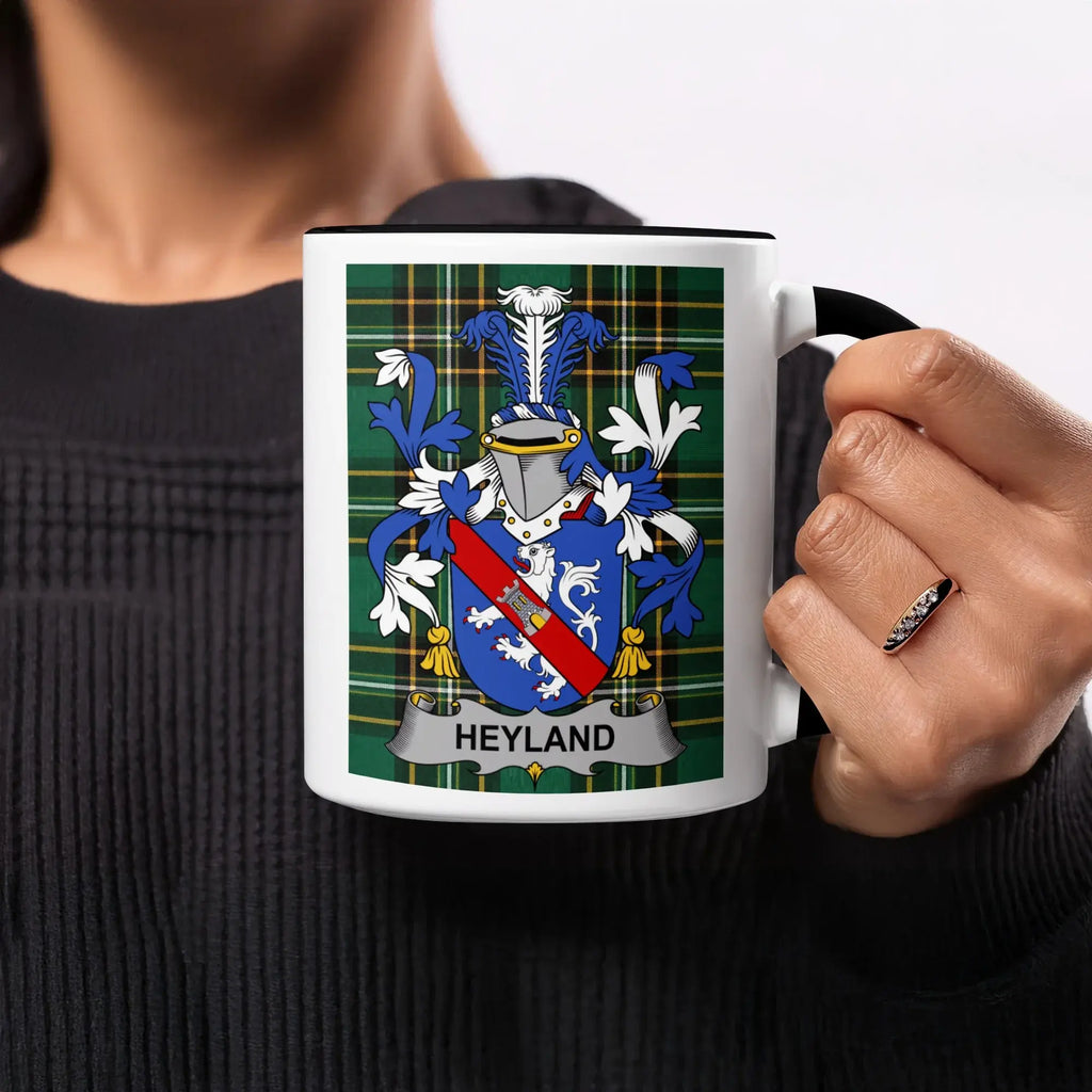 Mug with Heyland family crest on a tartan background.