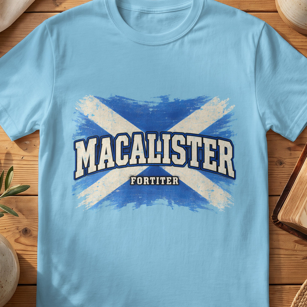 MacAlister Scottish Saltire T-shirt in Sky, with distressed blue and cream flag and “Fortiter” lettering.