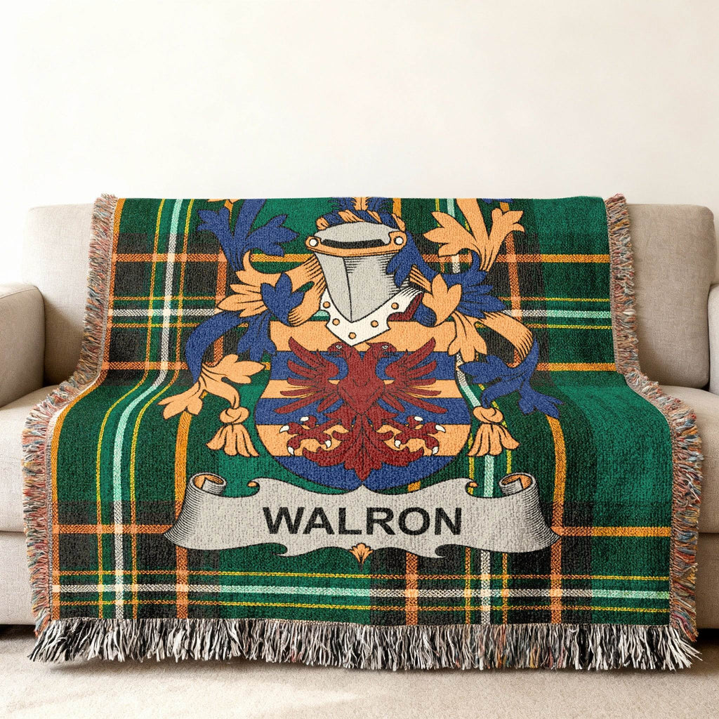 Walron family crest on a green tartan plaid throw blanket.