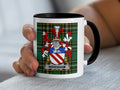 Mug with the WIDENHAM family crest on a plaid background.