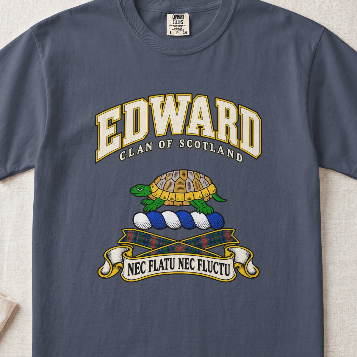 Edward Scottish clan T-shirt in Midnight, front view with a green and gold tortoise and motto design.
