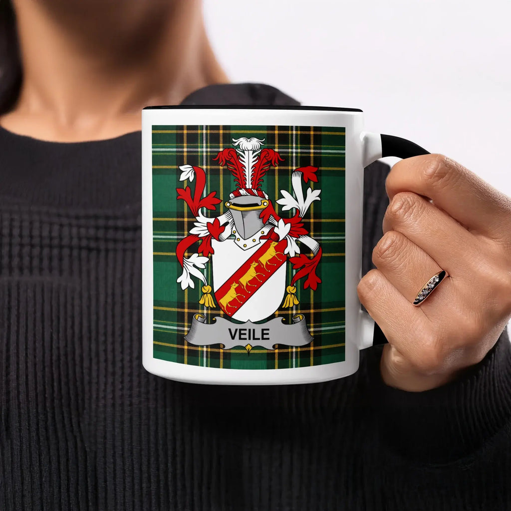 Mug with Veile family crest on plaid background.