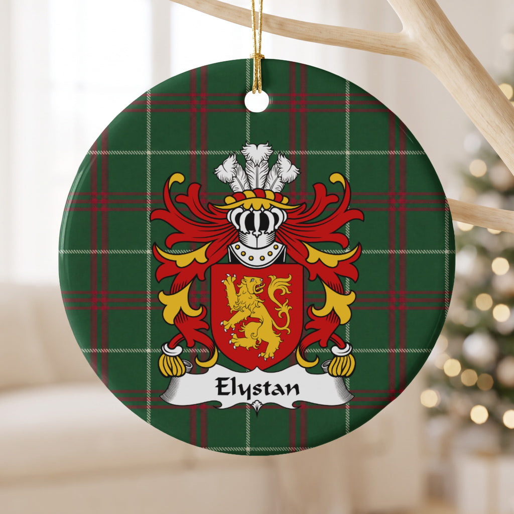 Elystan ornament hanging from a pale wooden branch; a gold lion on a red shield on Welsh national tartan.