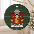 Elystan ornament hanging from a pale wooden branch; a gold lion on a red shield on Welsh national tartan.