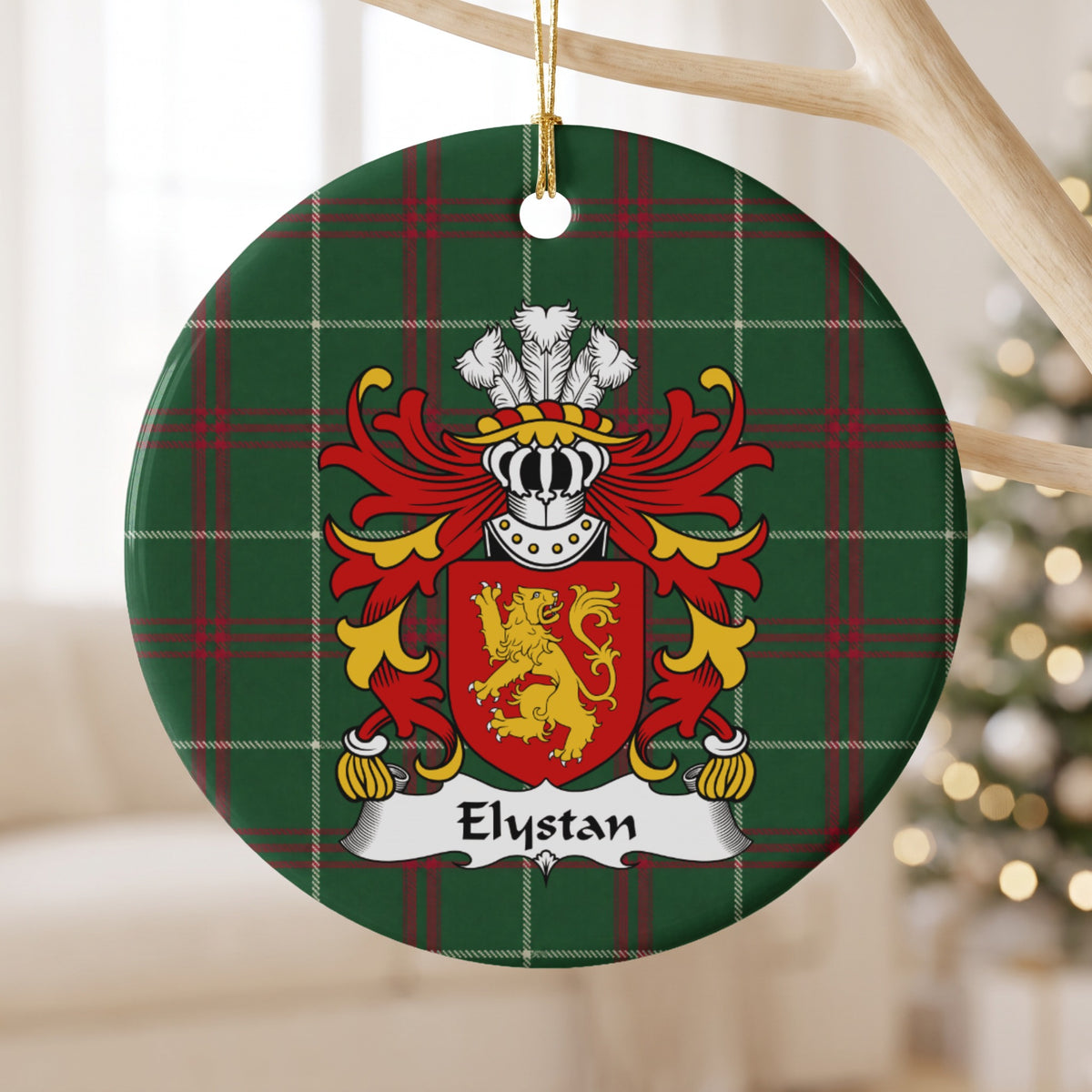 Elystan ornament hanging from a pale wooden branch; a gold lion on a red shield on Welsh national tartan.