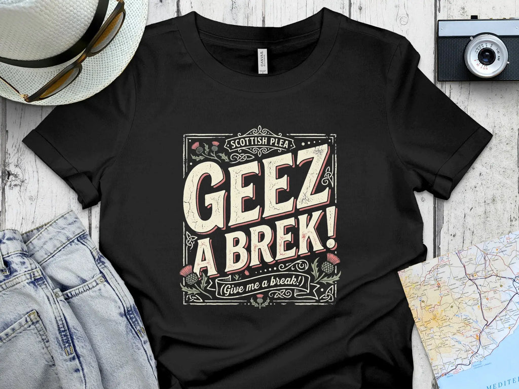 Black t-shirt with "GEEZ A BREK! (Give me a break!)" text.