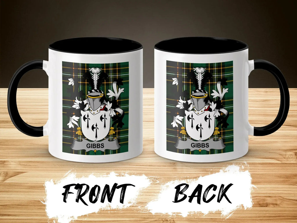 White mug with black rim and handle, featuring Gibbs family crest on front and back.