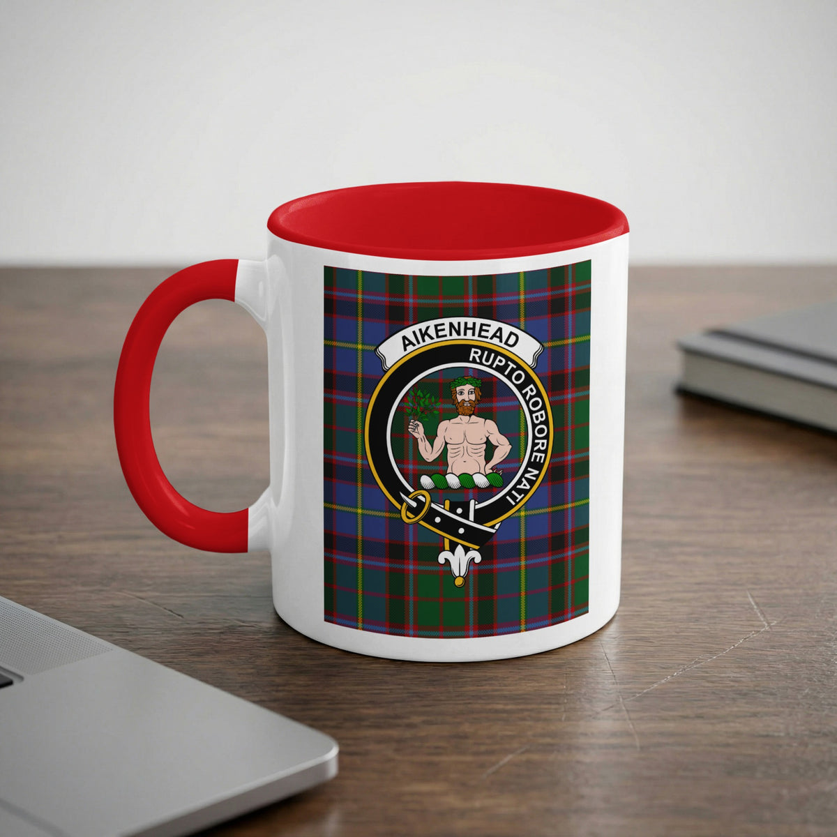 Aikenhead Scottish family crest artwork on an 11 oz red accent mug with a tartan background