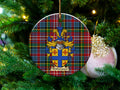 Witherspoon Scottish clan ceramic ornament with family crest on a Caledonia tartan background, hanging on a Christmas tree