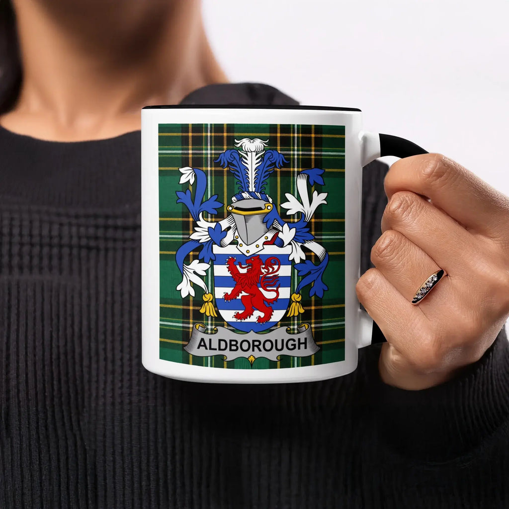Mug with Aldborough family crest on a tartan background.
