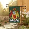 Griffiths family crest on a tartan flag hanging from a garden stake.