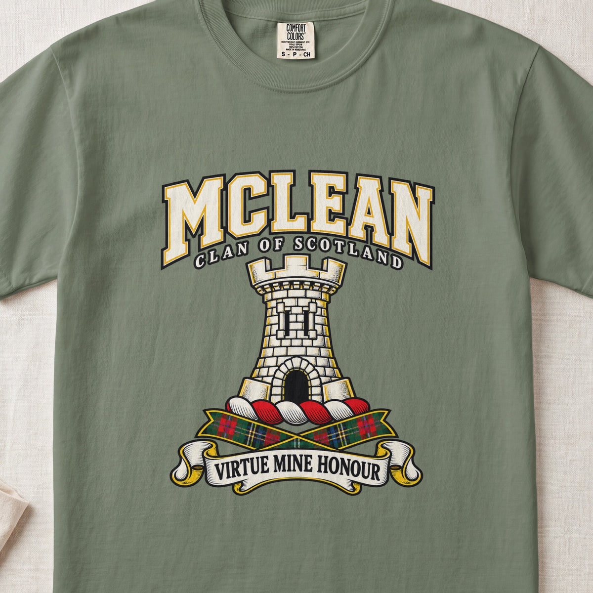 McLean graphic T-shirt in Moss green, front flat lay showing varsity lettering and white stone tower with battlements and arched doorway.
