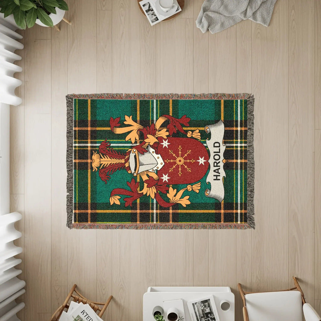 Woven throw blanket featuring the HAROLD family crest on a tartan background.