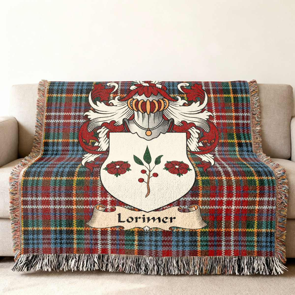 Lorimer family crest emblem on a Caledonia tartan woven blanket