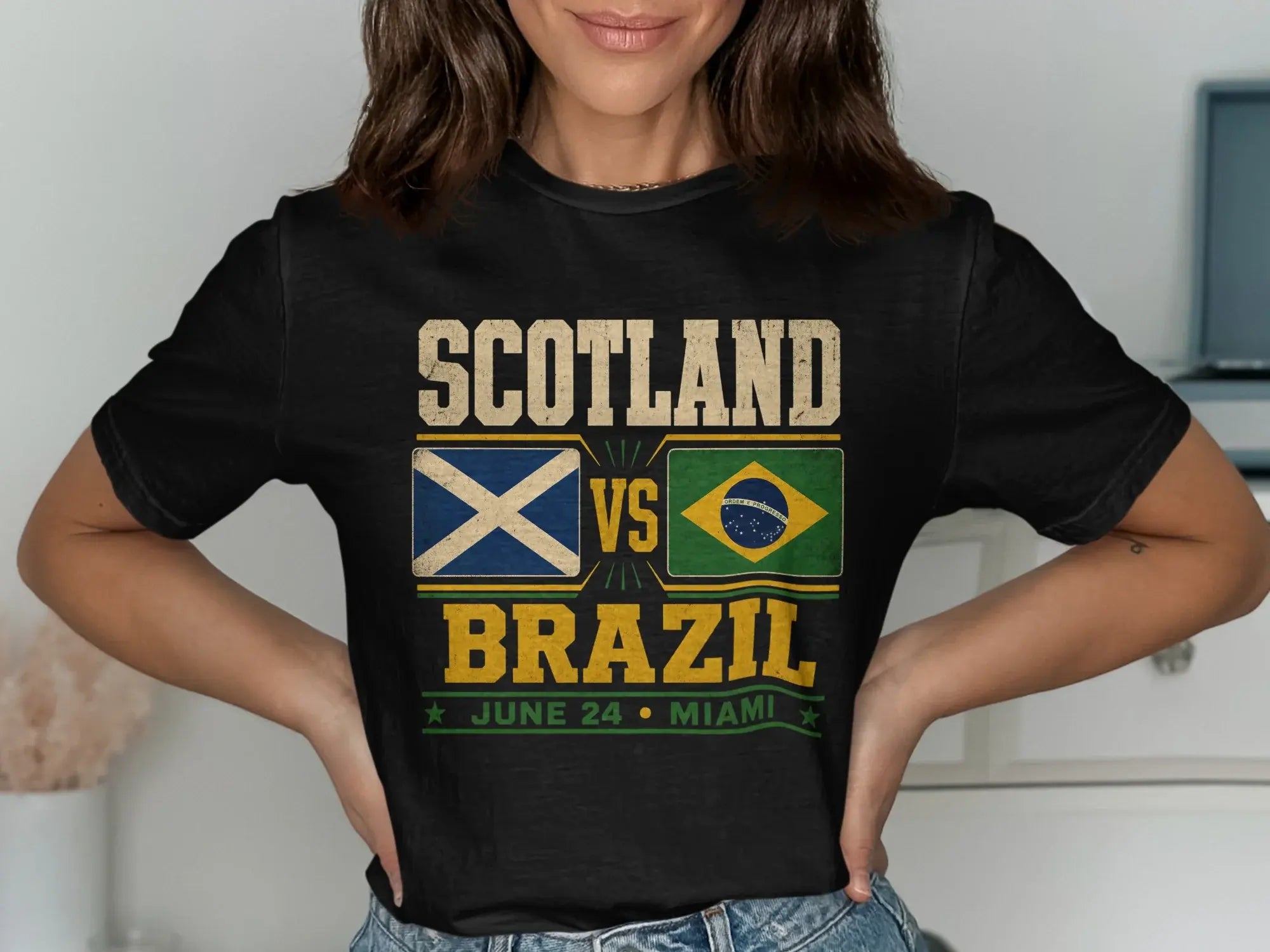 Scotland vs. Brazil soccer match t-shirt with flags and game details.