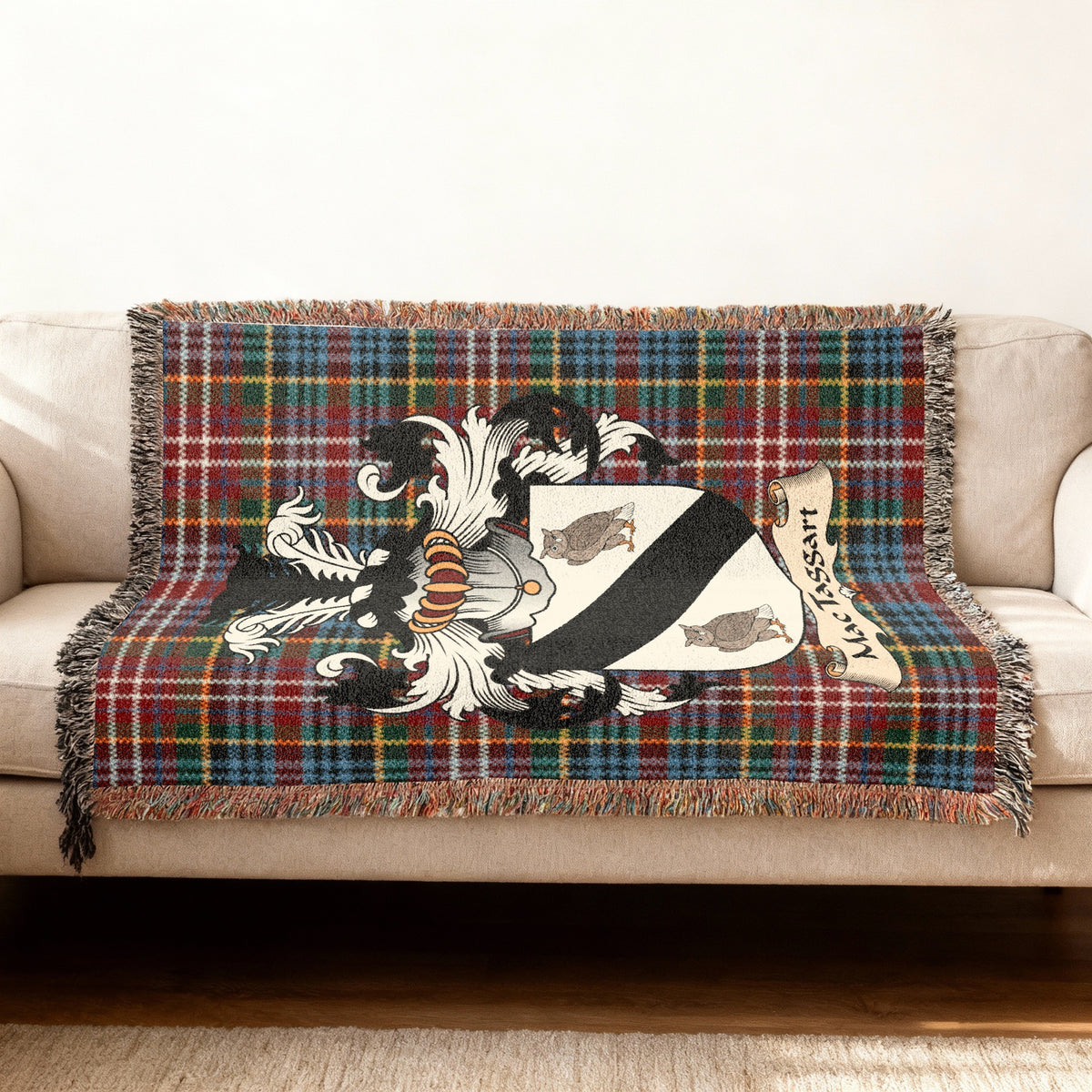 MacTaggart Scottish woven blanket with family shield and Caledonia tartan background