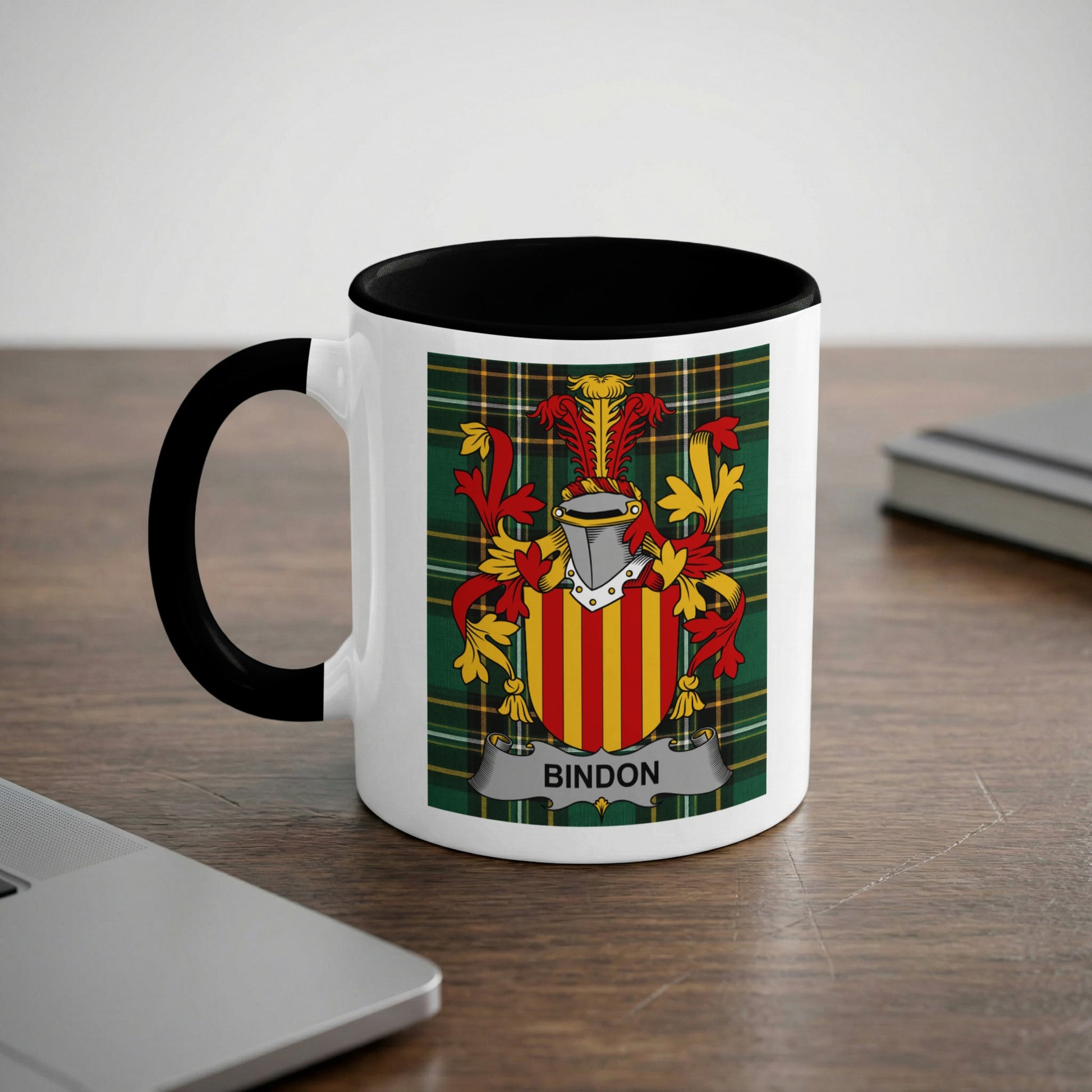 Mug with Bindon family crest on a wooden desk.
