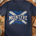 McIntyre Scottish Saltire T-shirt in Navy, with distressed blue and cream flag and “Per Ardua” lettering.