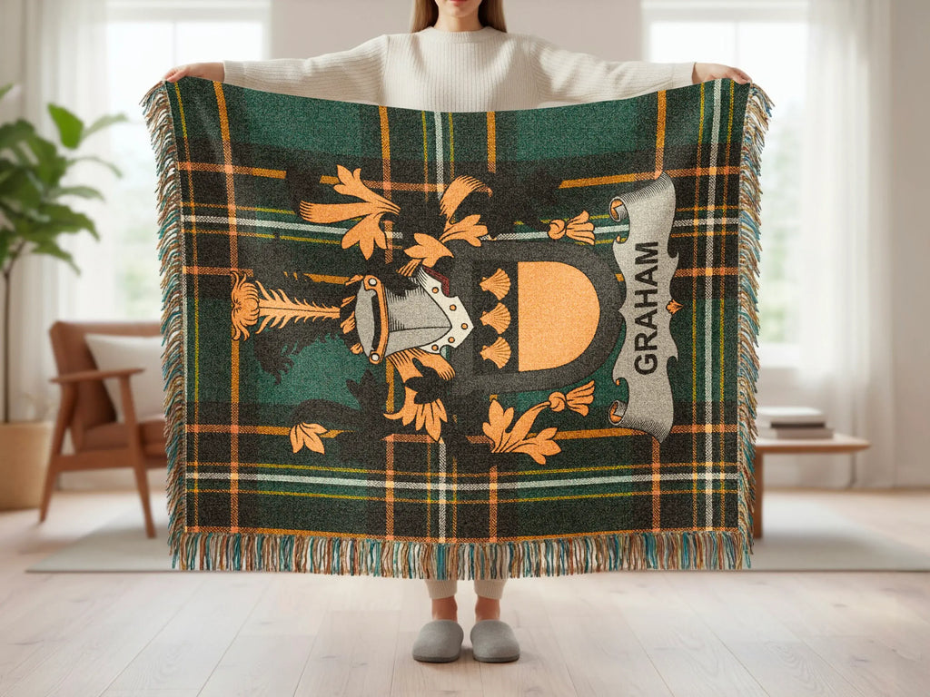 Graham Irish coat of arms woven throw held up — full green tartan crest design visible