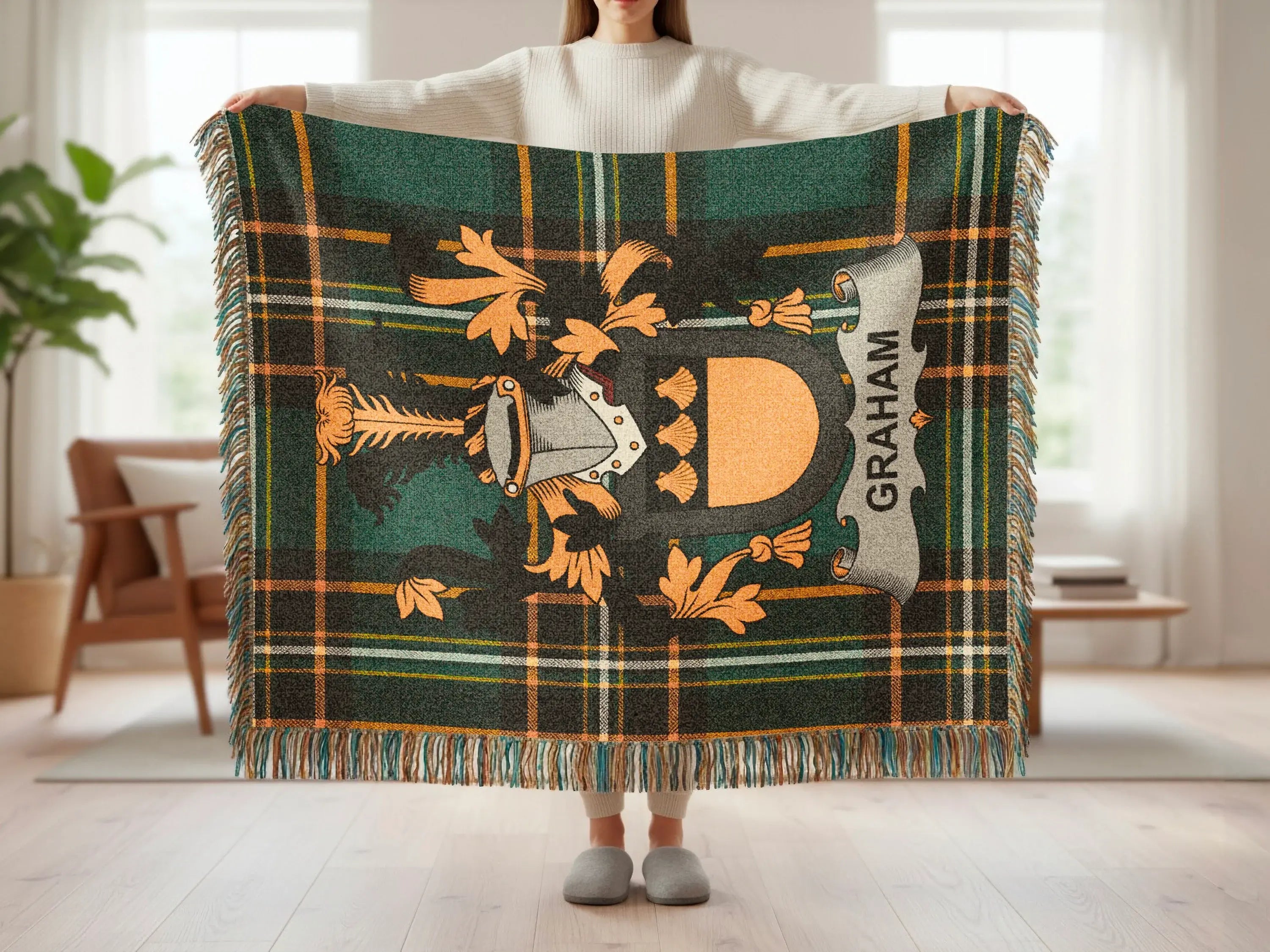 Graham Irish coat of arms woven throw held up — full green tartan crest design visible