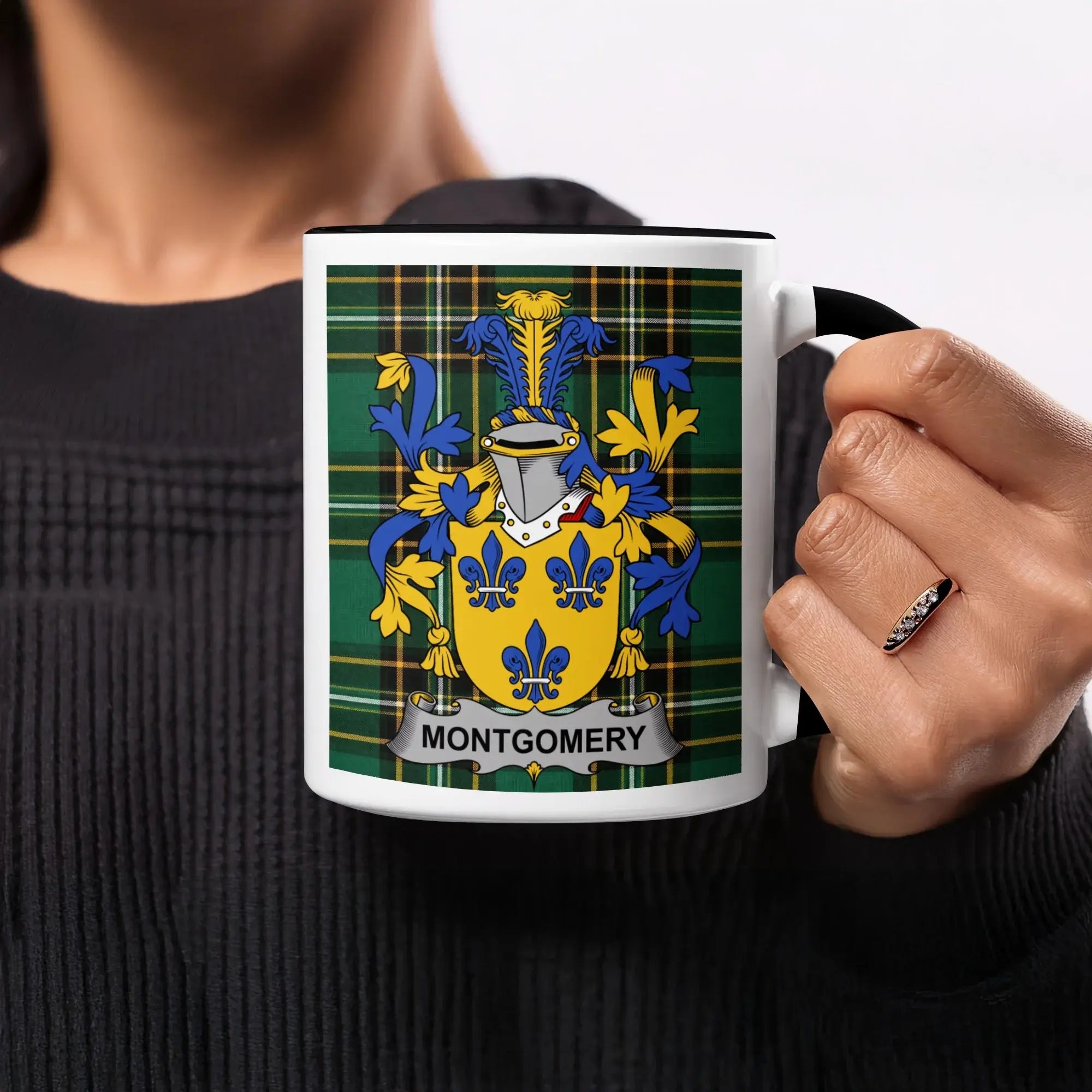 Montgomery clan crest tartan mug held in hand — 11oz glossy ceramic showing Gardez Bien motto