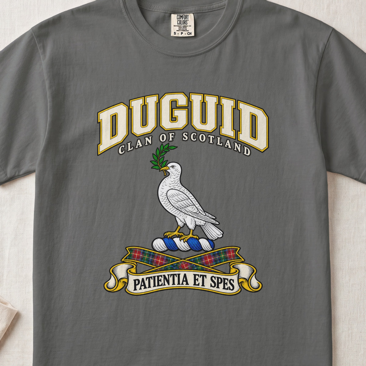 Duguid Scottish clan T-shirt in Pepper, front view with a white dove holding a green branch and motto design.