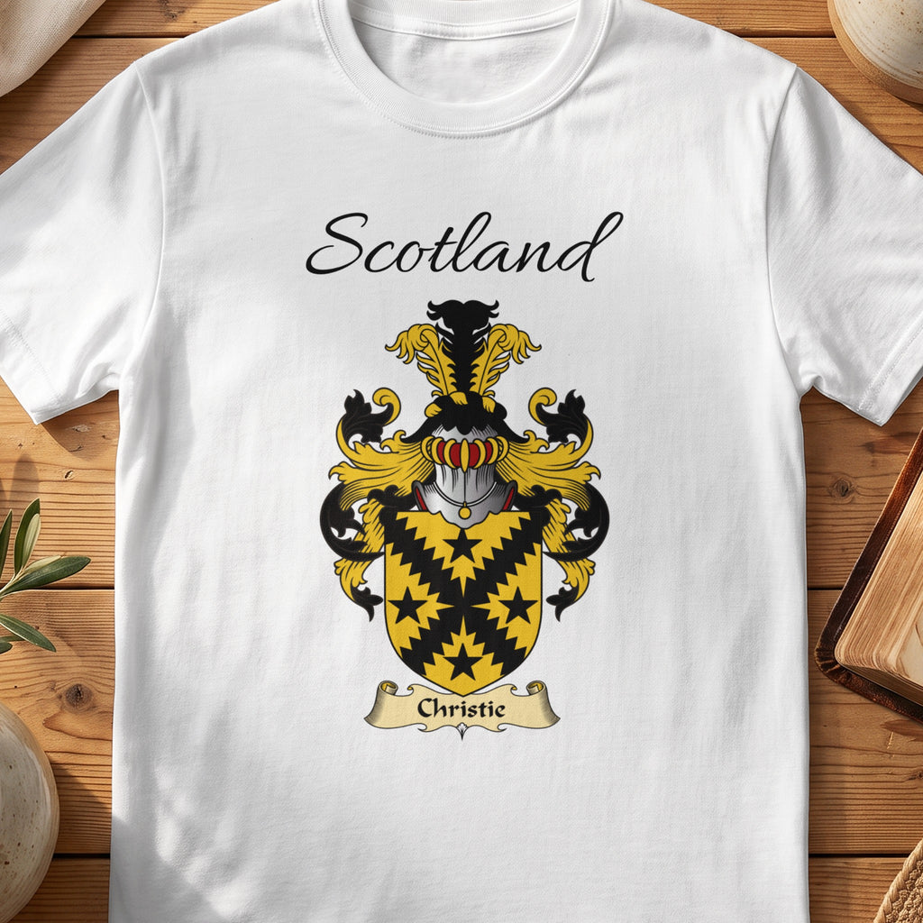 White Christie Scottish family shield T-shirt featuring a black jagged diagonal cross and star motifs on gold