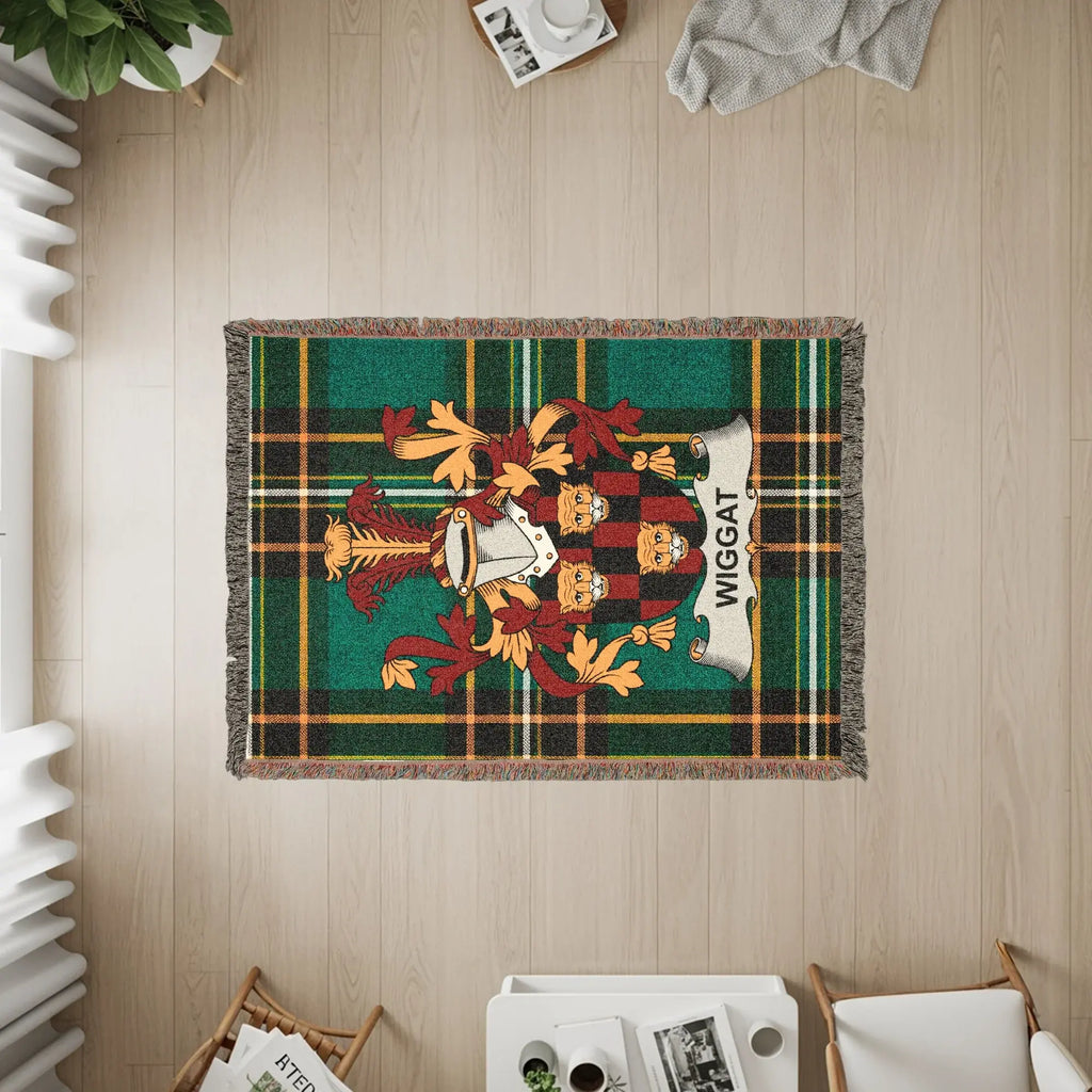 Wiggan tartan rug with coat of arms, laid on a wooden floor.