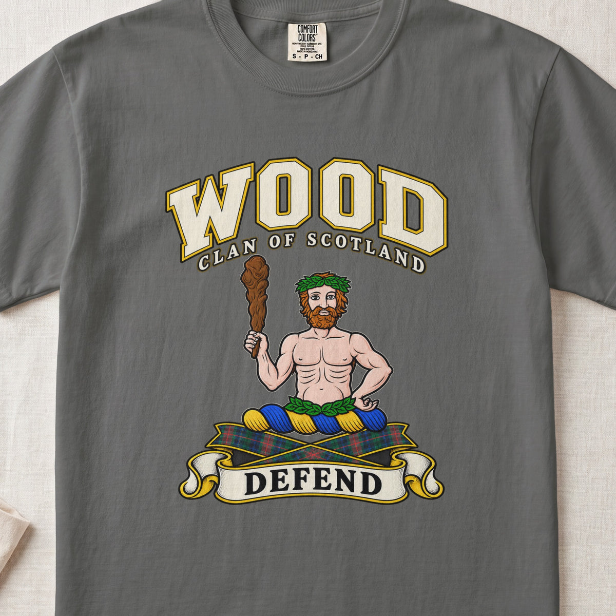 Wood Scottish clan T-shirt in Pepper, front view with a bearded figure holding a wooden club and motto banner.