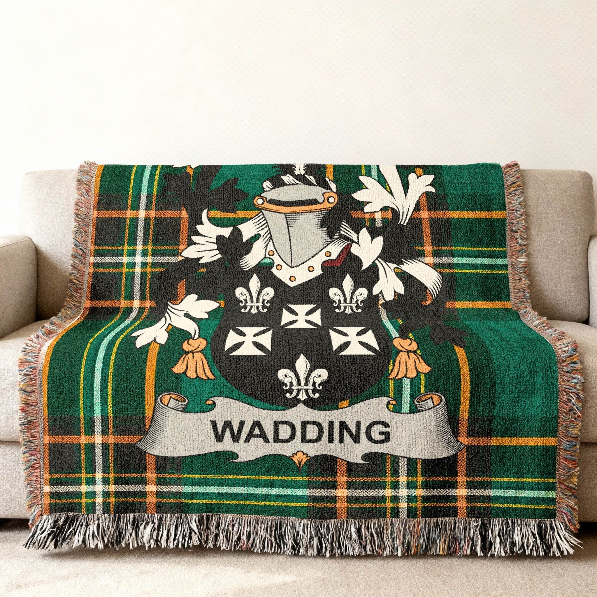 Wadding coat of arms on a green plaid woven throw blanket.