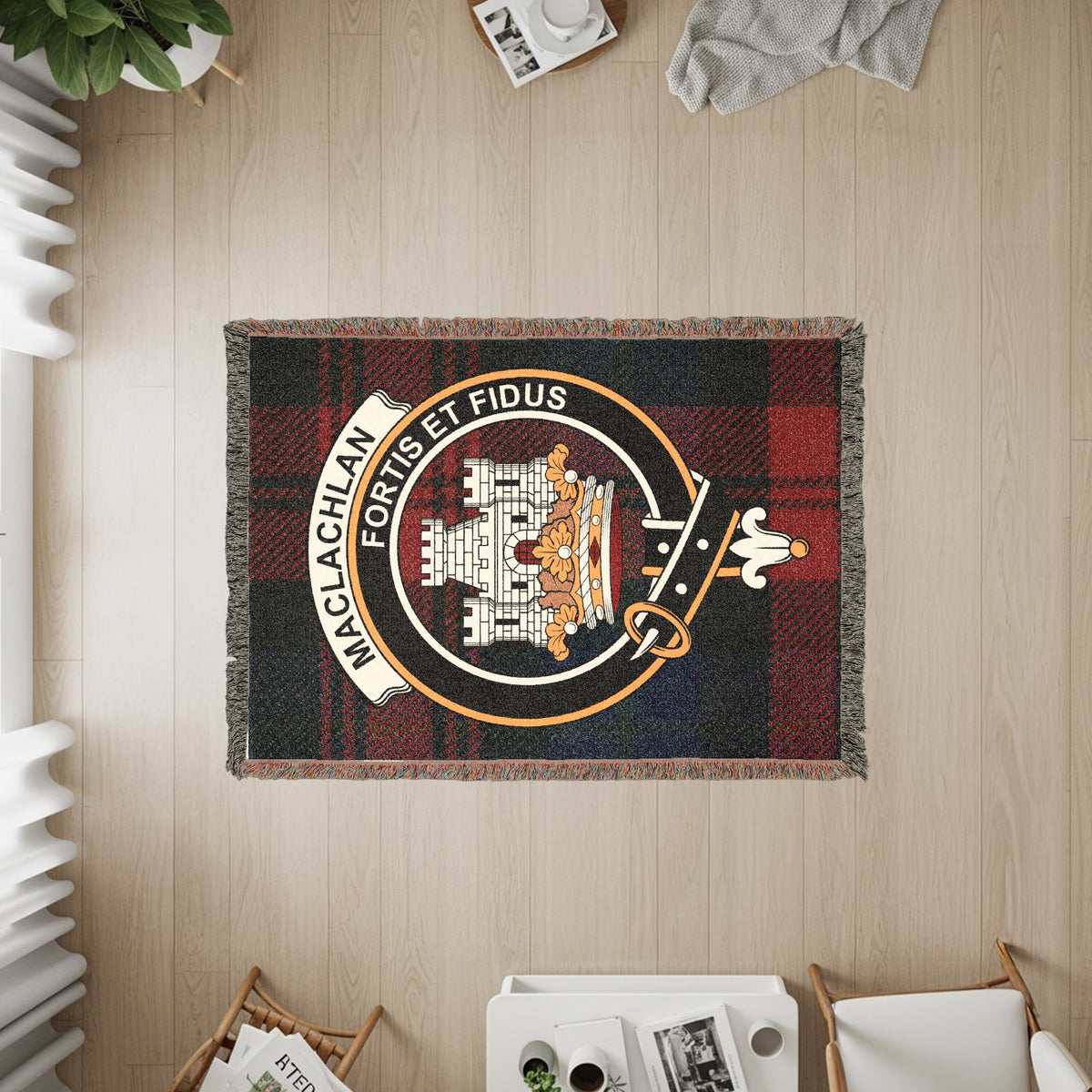 MacLachlan woven blanket displayed on a wall, featuring the crest badge and tartan background