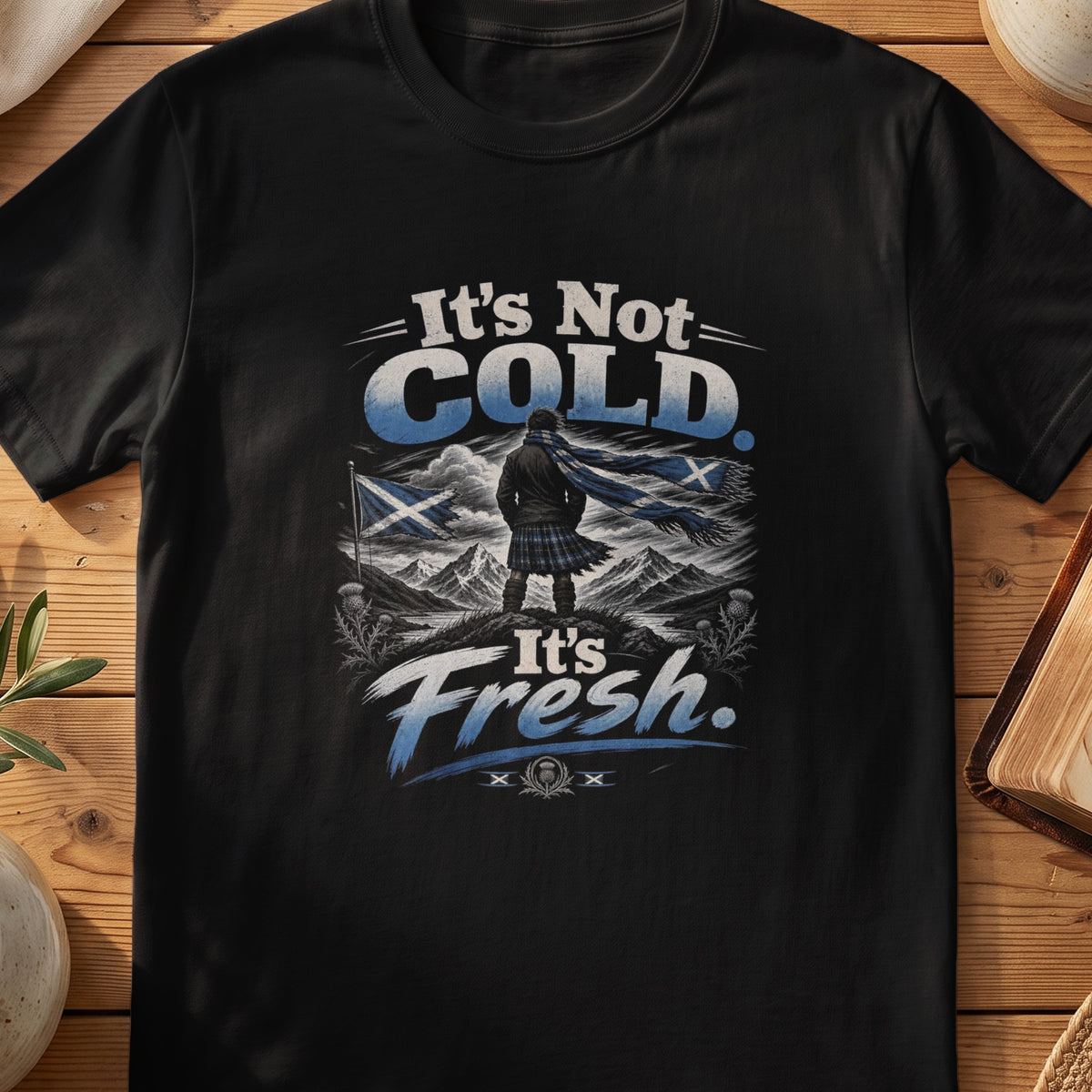 Black Gildan 64000 unisex T-shirt flatlay with It's Not Cold It's Fresh Scottish graphic design