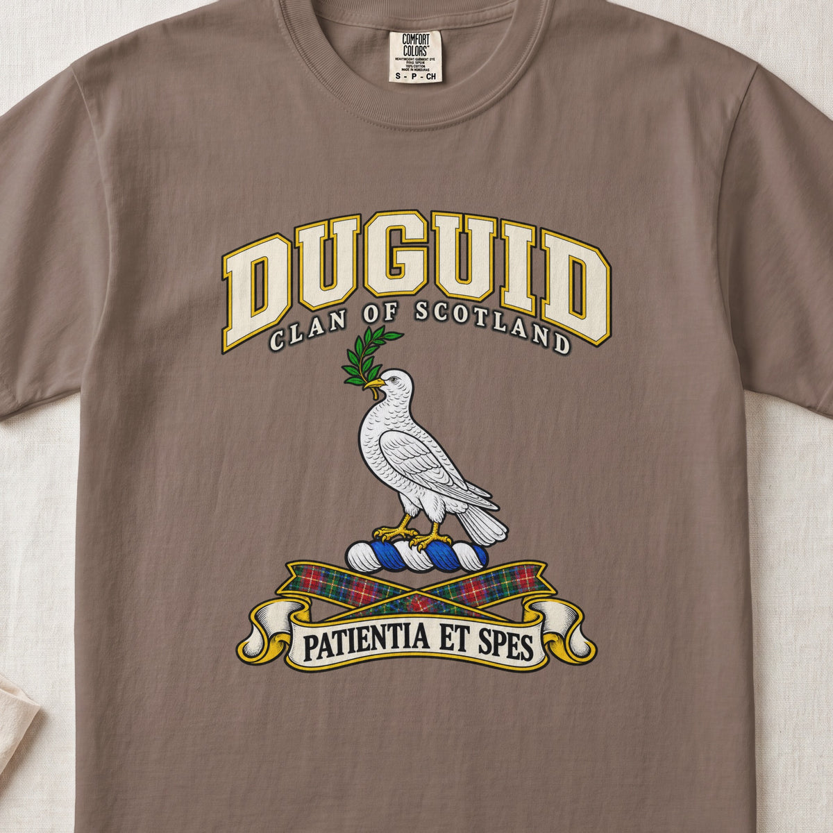 Duguid Scottish clan T-shirt in Espresso, front view with a white dove holding a green branch and motto design.