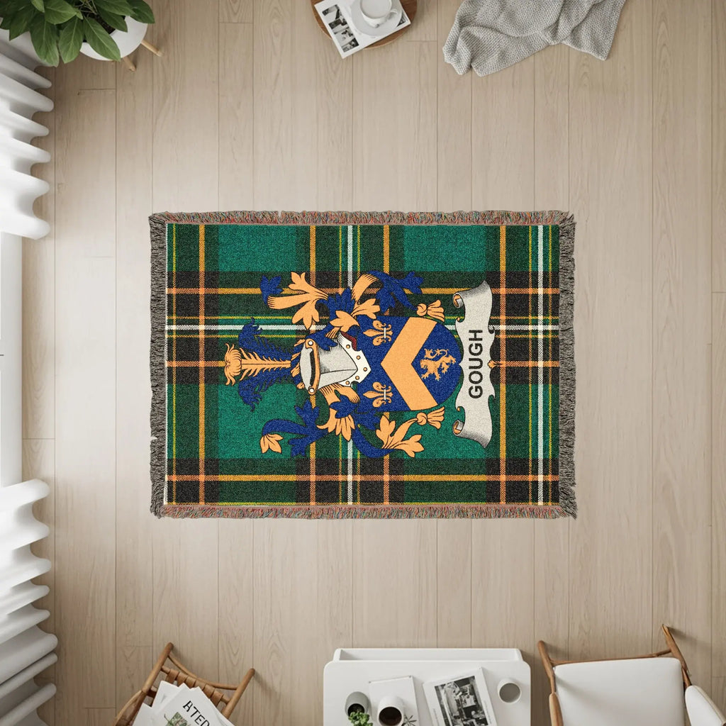 Gough family crest on a tartan woven throw blanket.