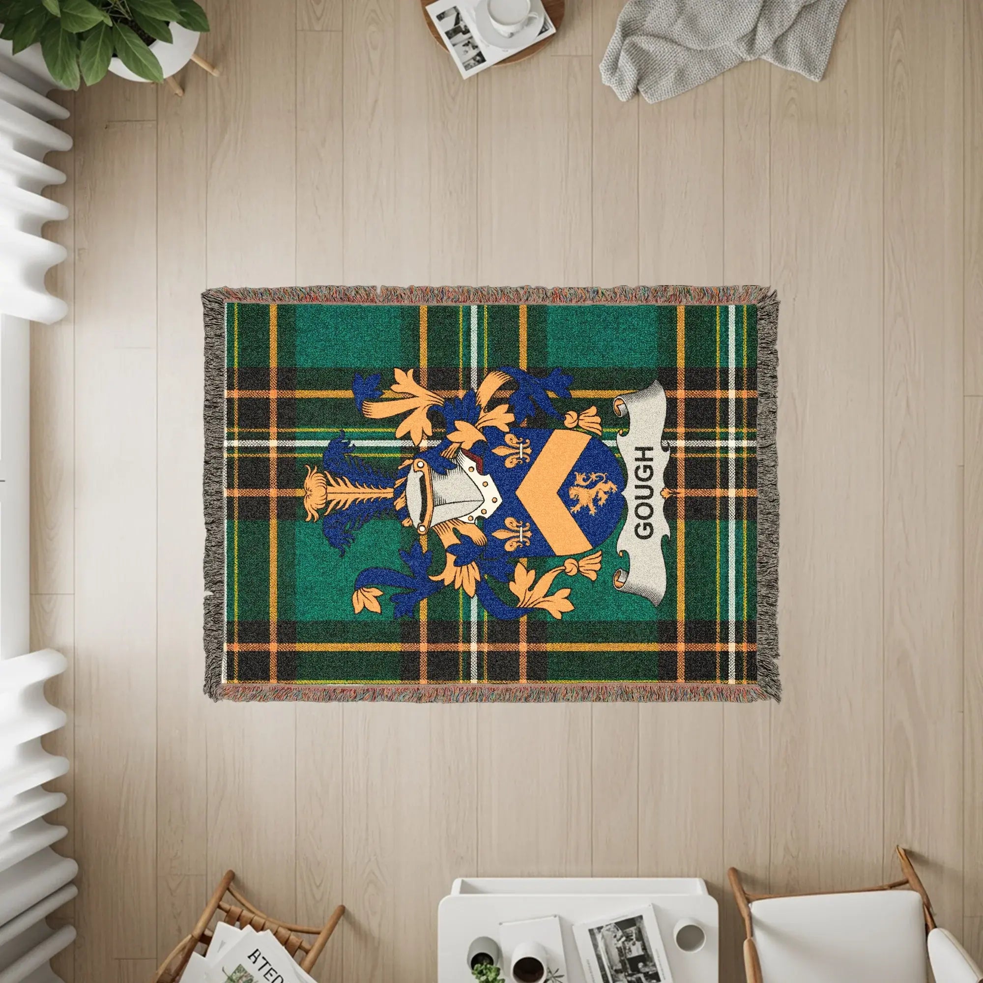Gough family crest on a tartan woven throw blanket.