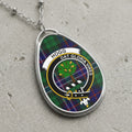 Oval pendant necklace with Hogg clan tartan and crest.