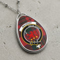 Macduff clan crest necklace on a tartan background with text "Deus Juvat".