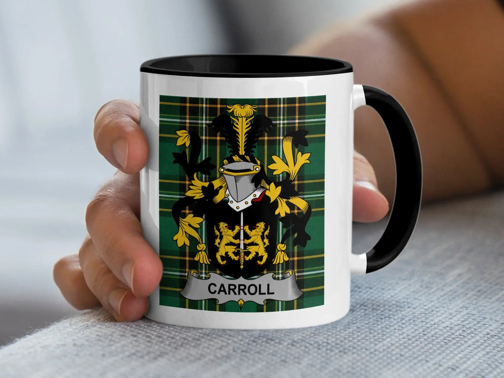 Mug with CARROLL crest and tartan pattern held by a person's hand.